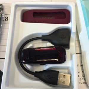 New in box Fitbit one.  Burgundy